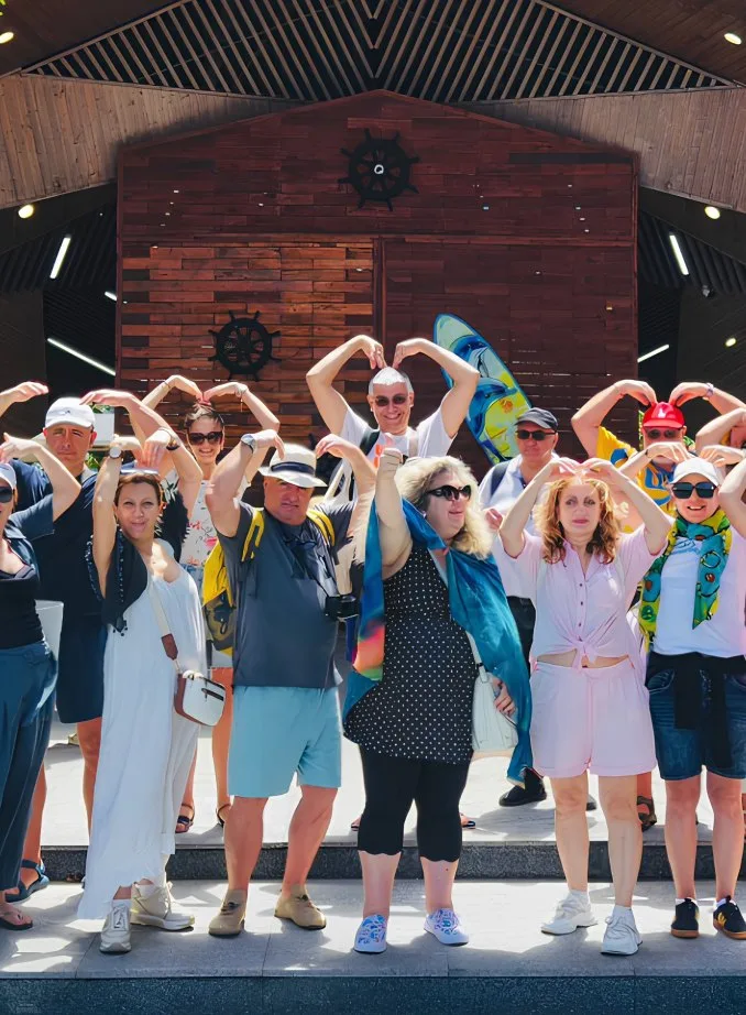 Kindtravel travellers making heart shapes in front of Phu Quoc Ocean Pearl
